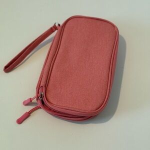 Pink electronic travel storage bag multiple pockets in two zippered pockets